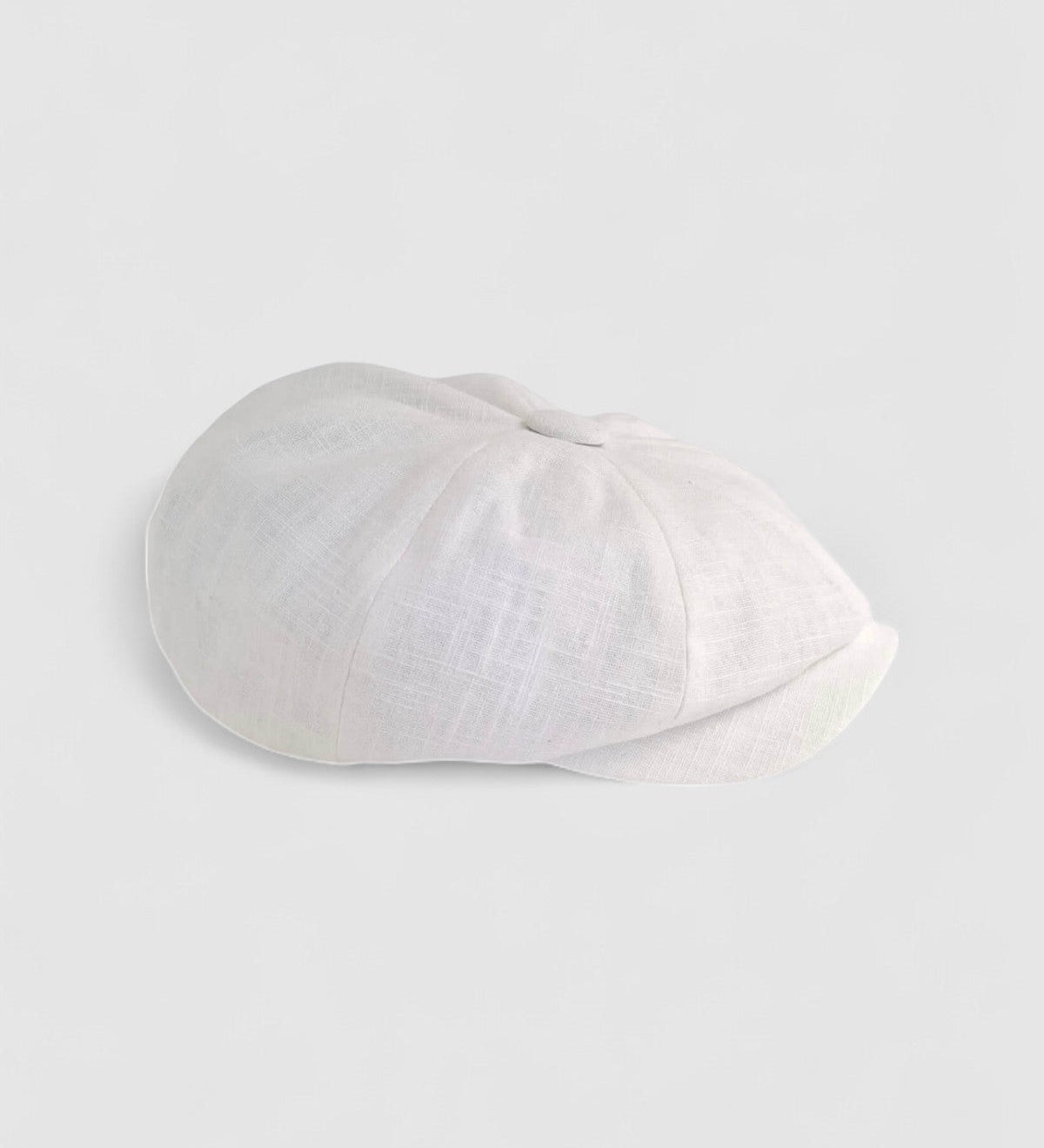 Bakerboy cap in white washed linen — Albert’s Beach, lightweight and summer-ready, handmade by Mister Miller. Profile view.