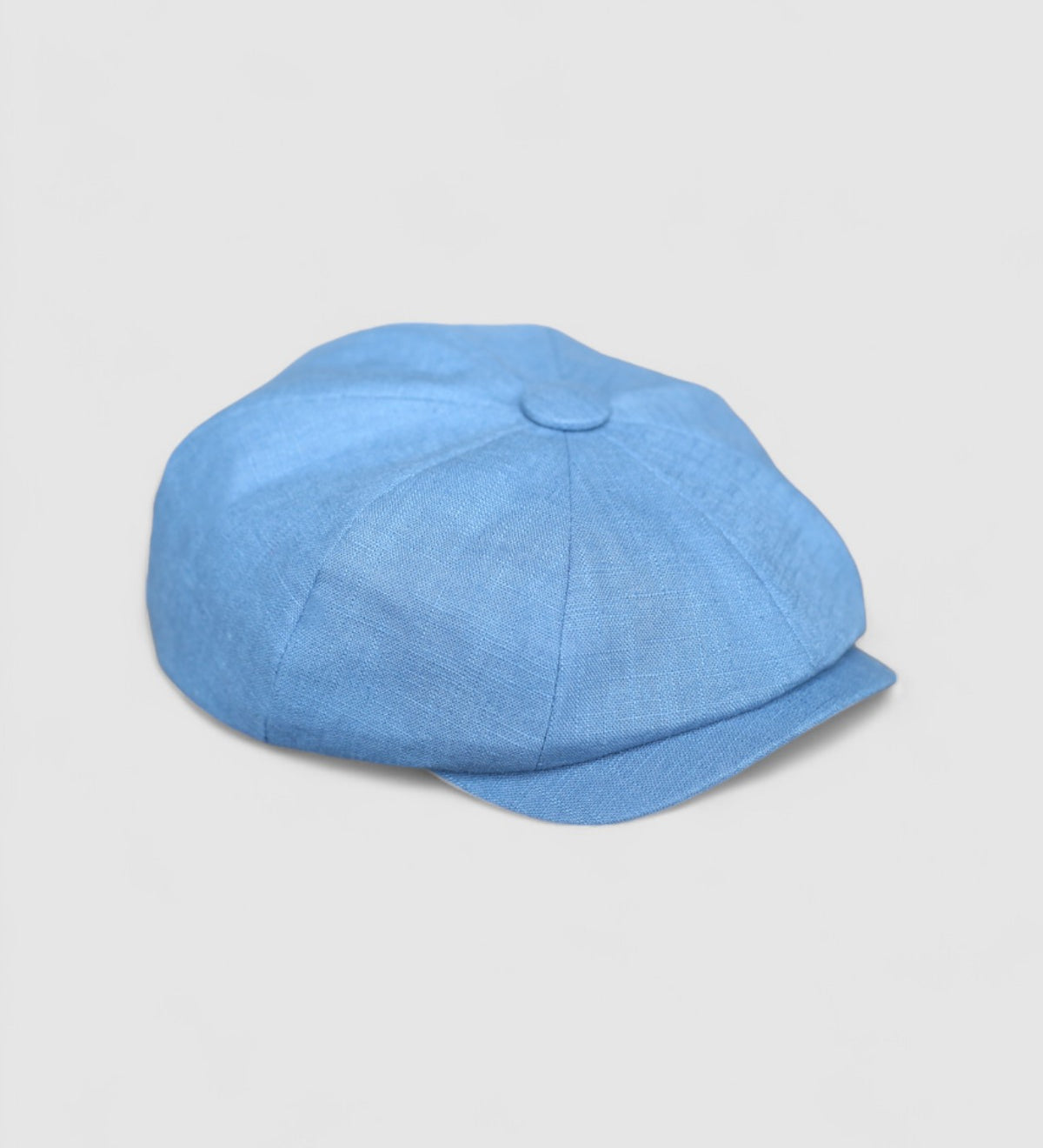 Bakerboy cap in ink-blue washed linen — Albert’s Wave, modern folded headband detail, handmade by Mister Miller. side view.