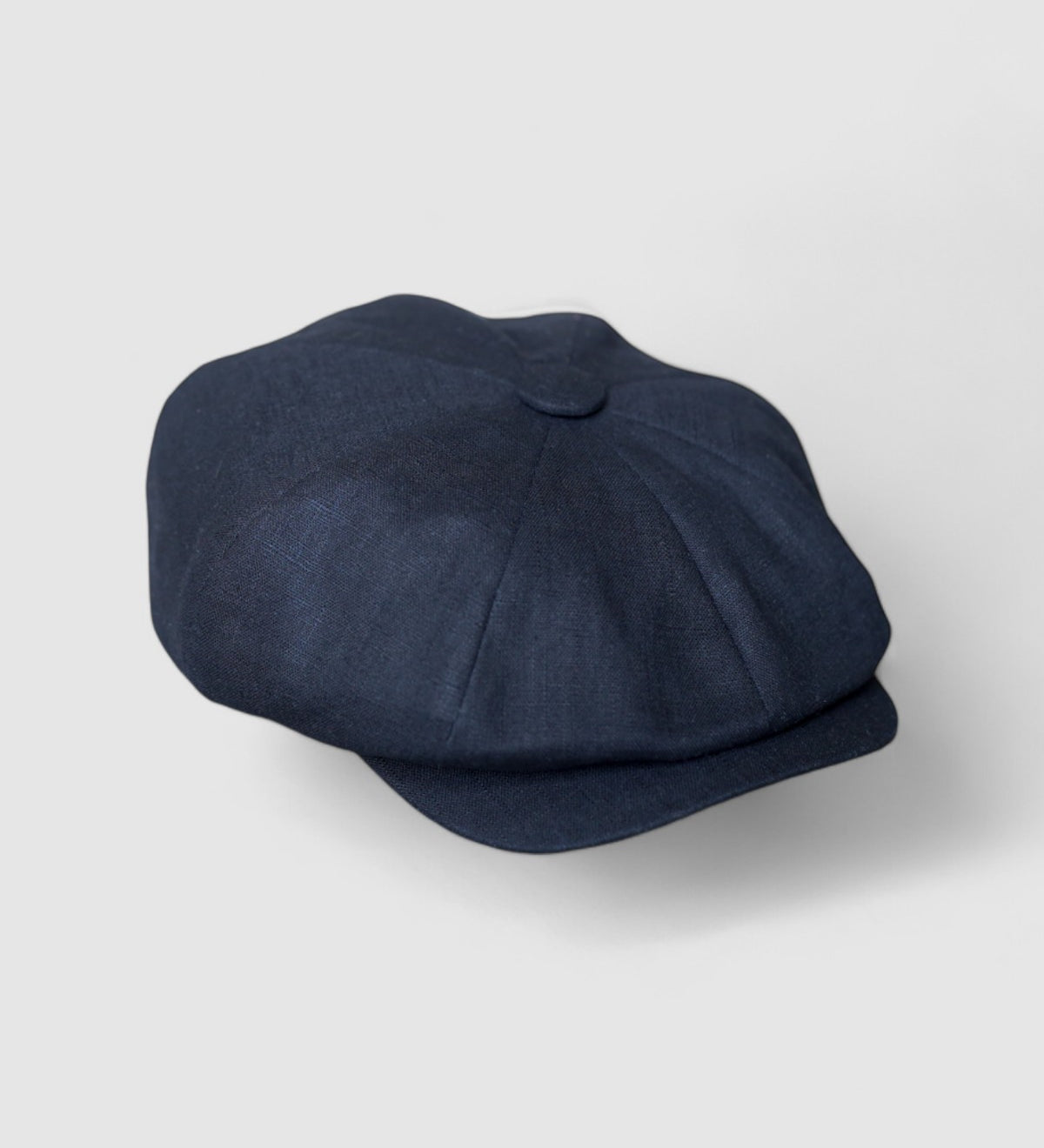 Bakerboy cap in black washed linen — Albert’s Nights, versatile spring/summer style, handmade by Mister Miller. side view.