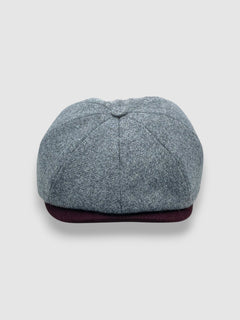Newsboy cap in grey Merino lambswool with dark red contrast peak – Jack’s Bluff by Mister Miller. front view