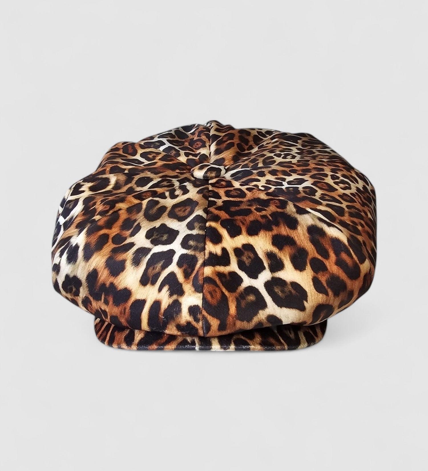 Leopard print velvet Bakerboy cap — oversized silhouette from the Leigh Francis x Mister Miller collection, featuring curved peak, bold 90s style, and signature 70s swirl lining.