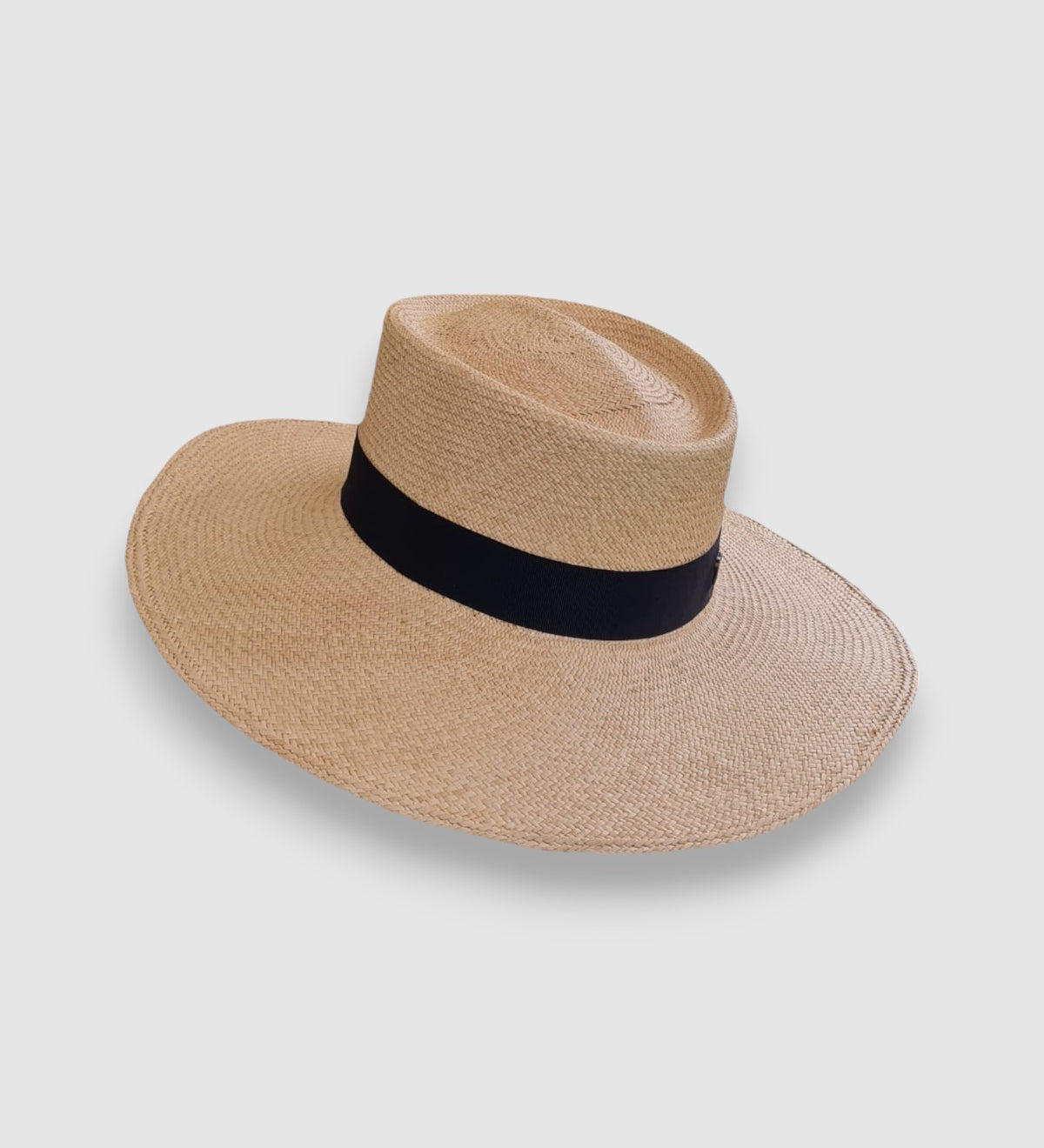 Wide brim Panama hat in natural Toquilla straw with black grosgrain ribbon, handmade in Ecuador, finished by Mister Miller.