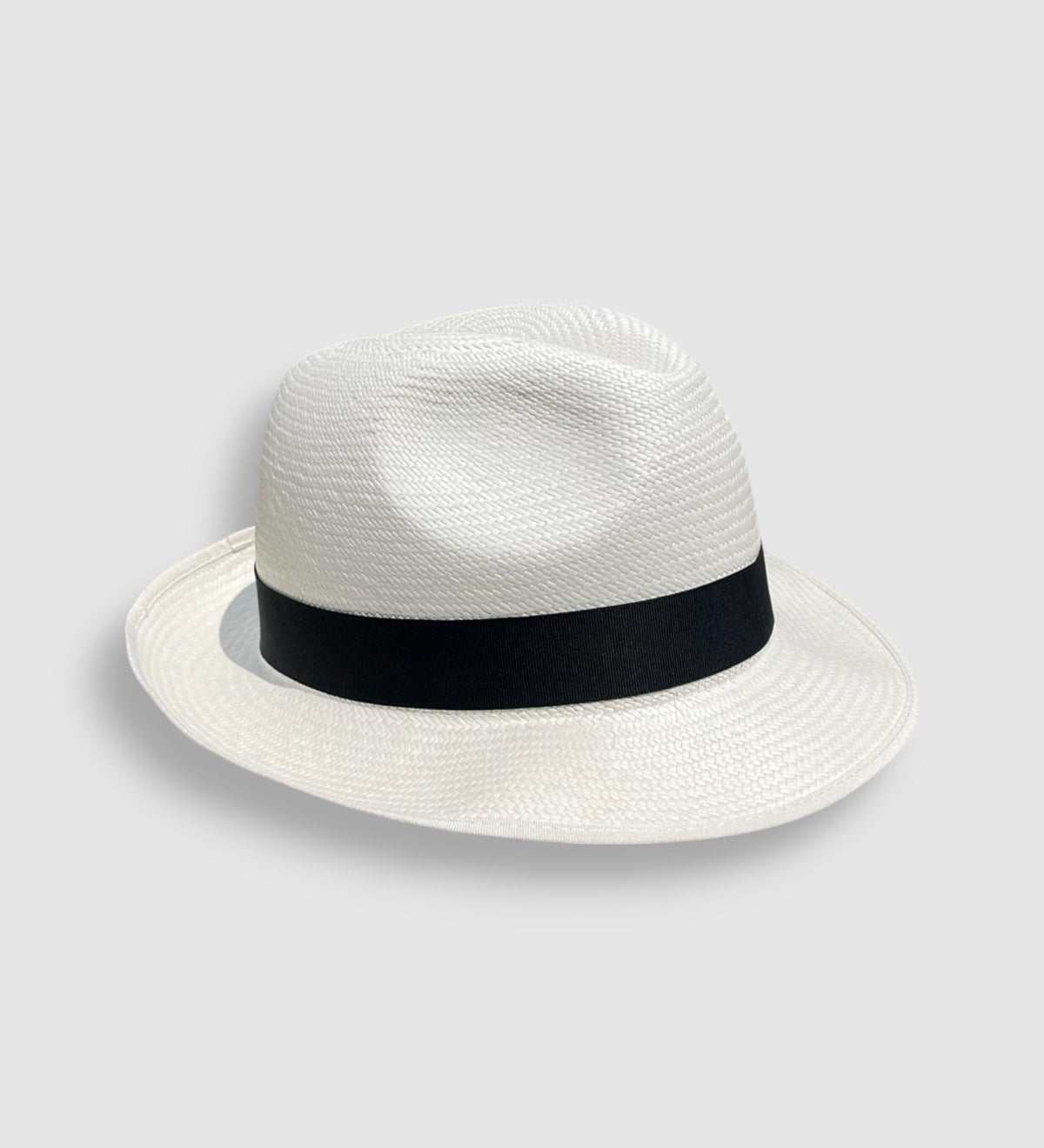 Handwoven Panama hat with black grosgrain ribbon, snapped front and turned-up back, by Mister Miller.