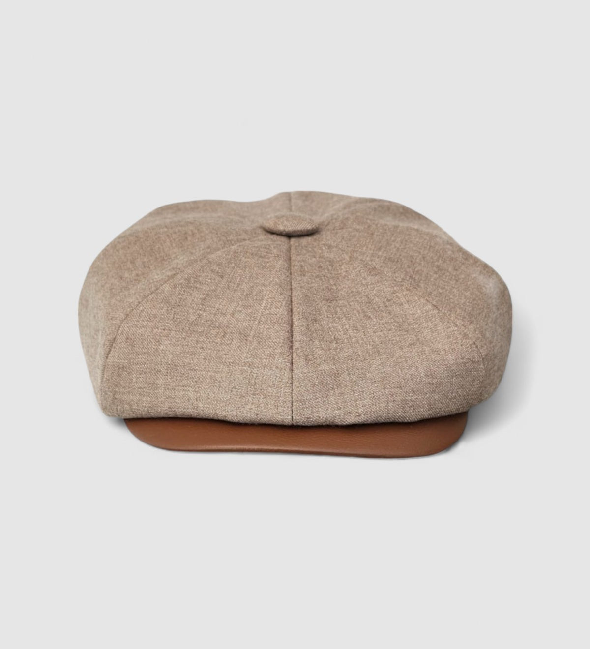 Bakerboy cap in beige cashmere wool with tan calfskin leather peak — Riley Says by Mister Miller, handmade in Britain for timeless style and quiet luxury. Front view