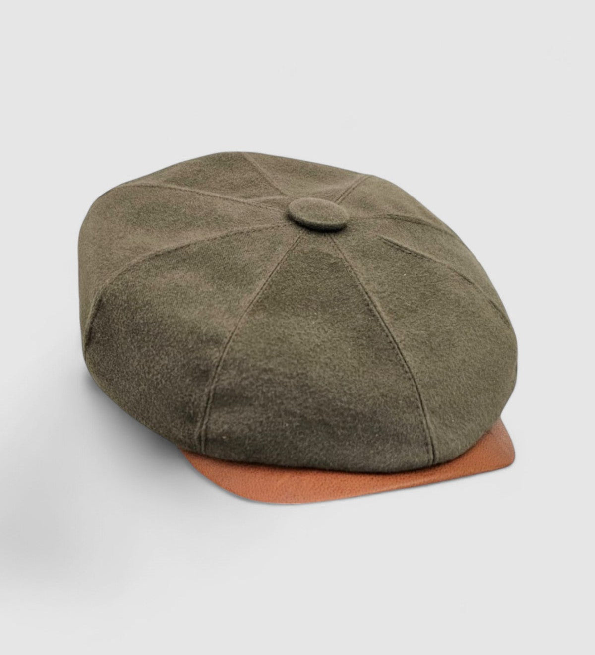 Bakerboy cap in racing green water-repellent cotton moleskin with tan calfskin leather peak — Riley’s Gears by Mister Miller, handmade in Britain for refined weatherproof style. side view