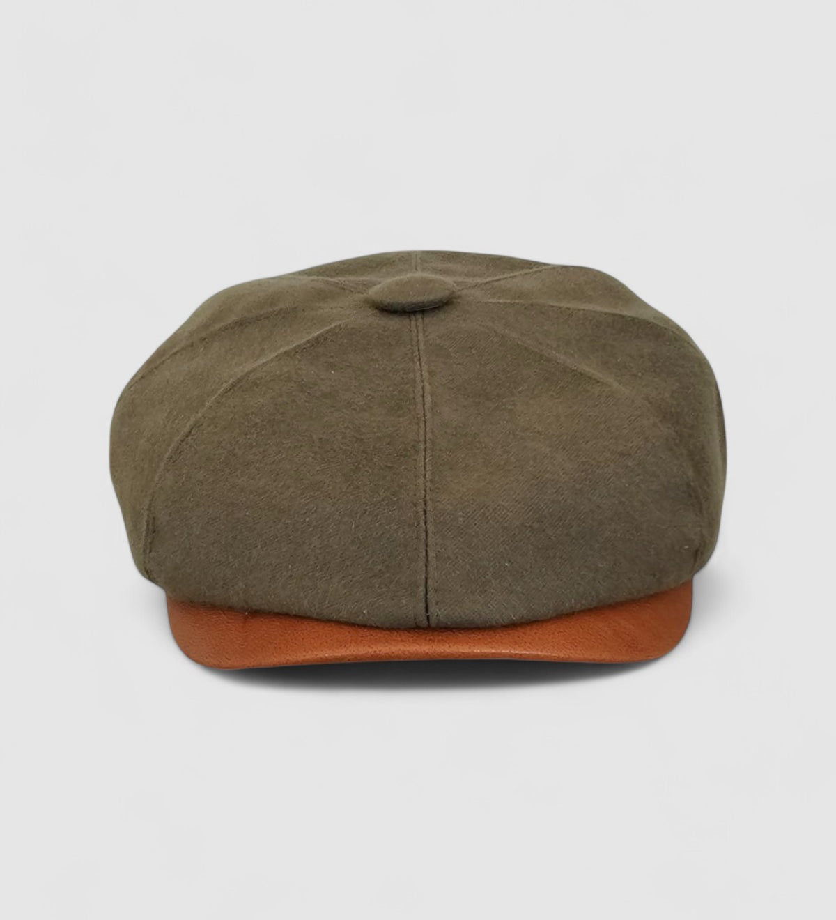 Bakerboy cap in racing green water-repellent cotton moleskin with tan calfskin leather peak — Riley’s Gears by Mister Miller, handmade in Britain for refined weatherproof style. Front view