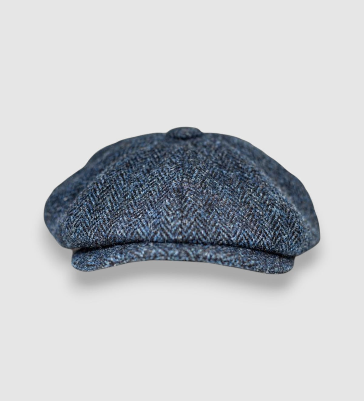 Bakerboy cap in navy and black Harris tweed — Riley’s Trail by Mister Miller, handmade in Britain. front view