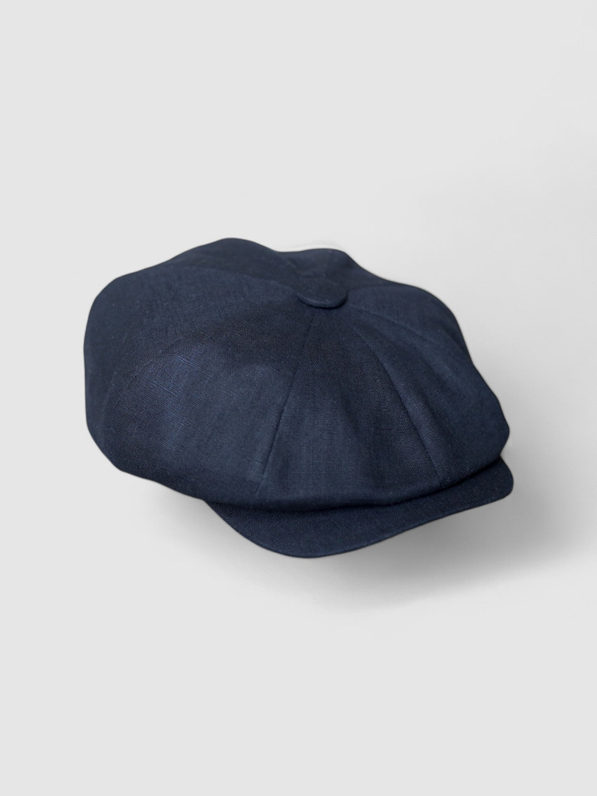 Bakerboy cap in black washed linen — Albert’s Nights, versatile spring/summer style, handmade by Mister Miller. side view.