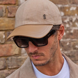 man wearing a cashmere baseball cap with sunglasses