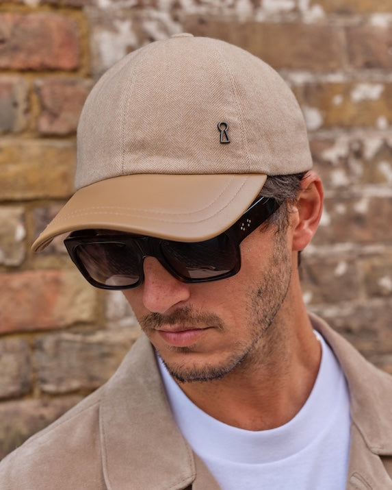 man wearing a cashmere baseball cap with sunglasses
