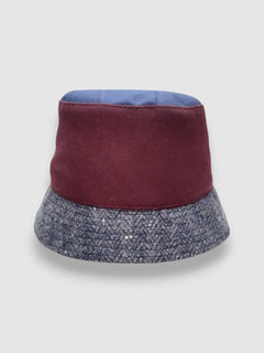 Crimson wool bucket hat with tweed brim, handmade by Mister Miller.