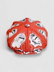 Oversized red Bakerboy cap with  70s-style illustrations — The Fame by Leigh Francis x Mister Miller, front view  