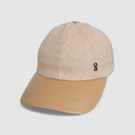 Camel cashmere herringbone baseball cap with tan leather peak, by Mister Miller. angle view