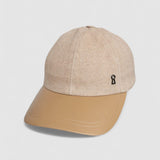Camel cashmere herringbone baseball cap with tan leather peak, by Mister Miller. angle view