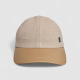 Camel cashmere herringbone baseball cap with tan leather peak, by Mister Miller.