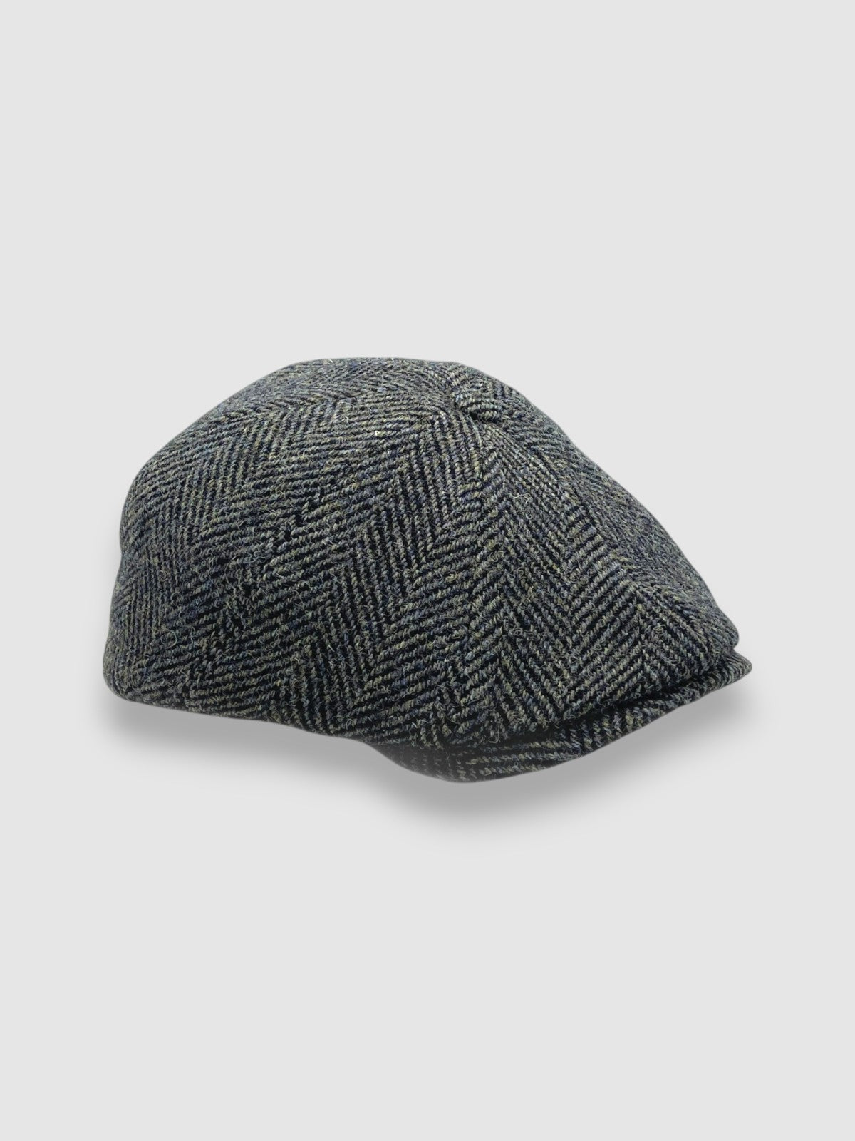 Newsboy cap in black and brown Harris tweed herringbone – Jack’s Gypsy by Mister Miller. side view