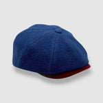 Newsboy cap in teal Melton wool with red and grey contrast peak – Jack’s Steal by Mister Miller. side view