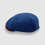 Newsboy cap in teal Melton wool with red and grey contrast peak – Jack’s Steal by Mister Miller. profile view