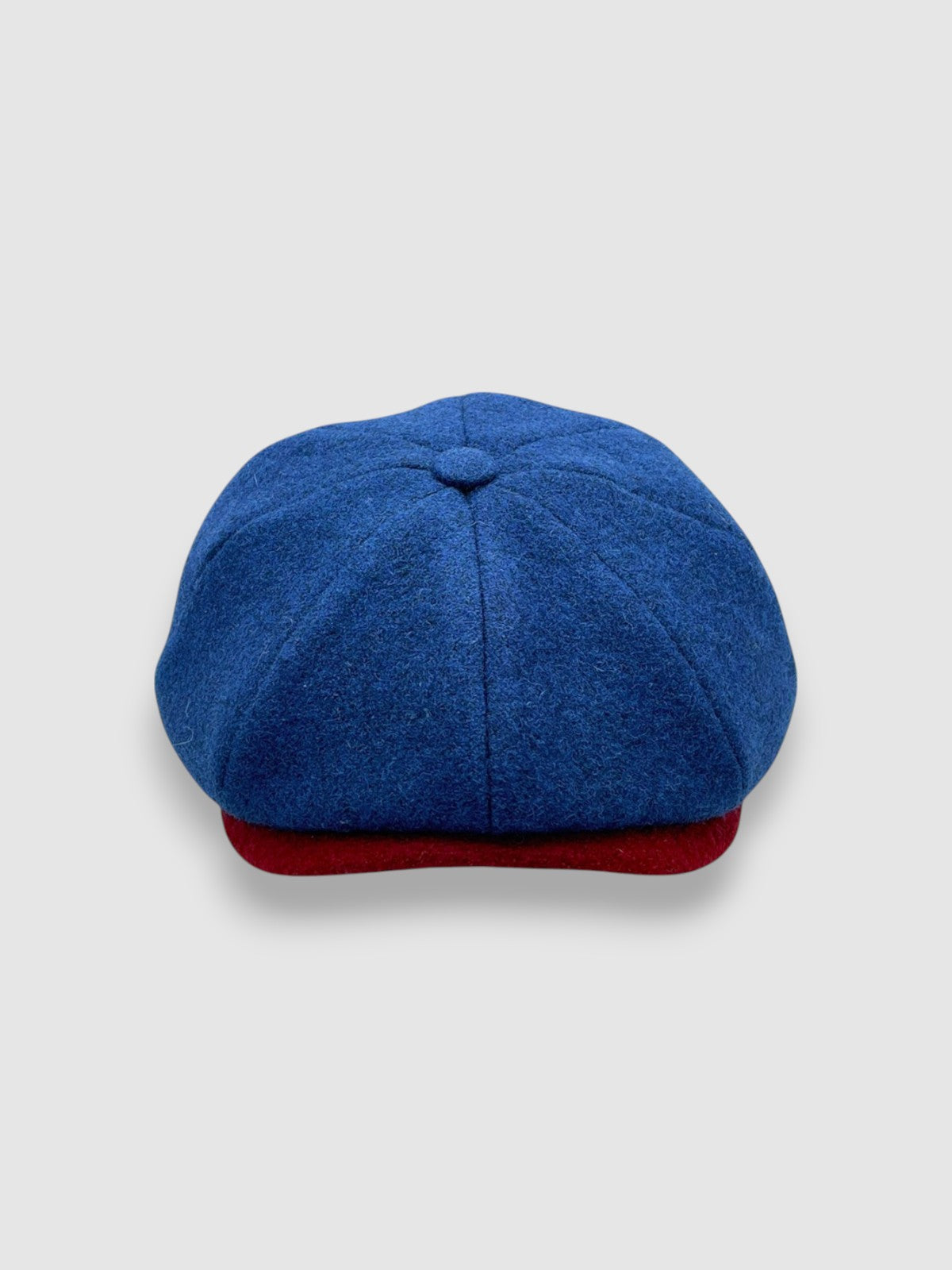 Newsboy cap in teal Melton wool with red and grey contrast peak – Jack’s Steal by Mister Miller. front view