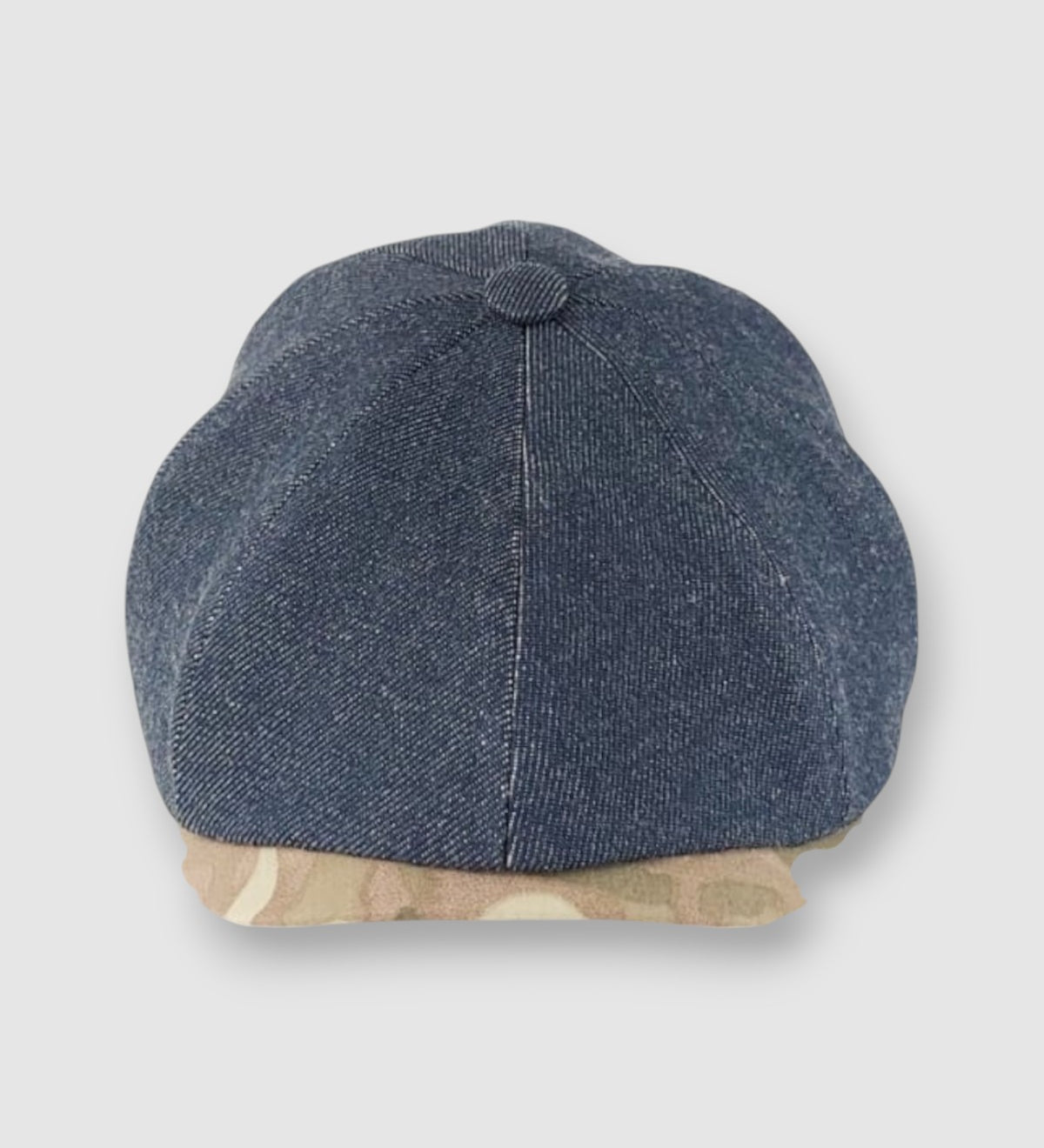 Newsboy cap in denim with camouflage peak – Jack’s Jeans slim-cut 8-panel flat cap handmade in Britain by Mister Miller. front view