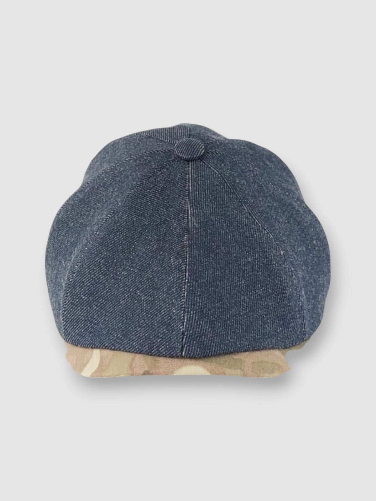 Newsboy cap in denim with camouflage peak – Jack’s Jeans slim-cut 8-panel flat cap handmade in Britain by Mister Miller. front view