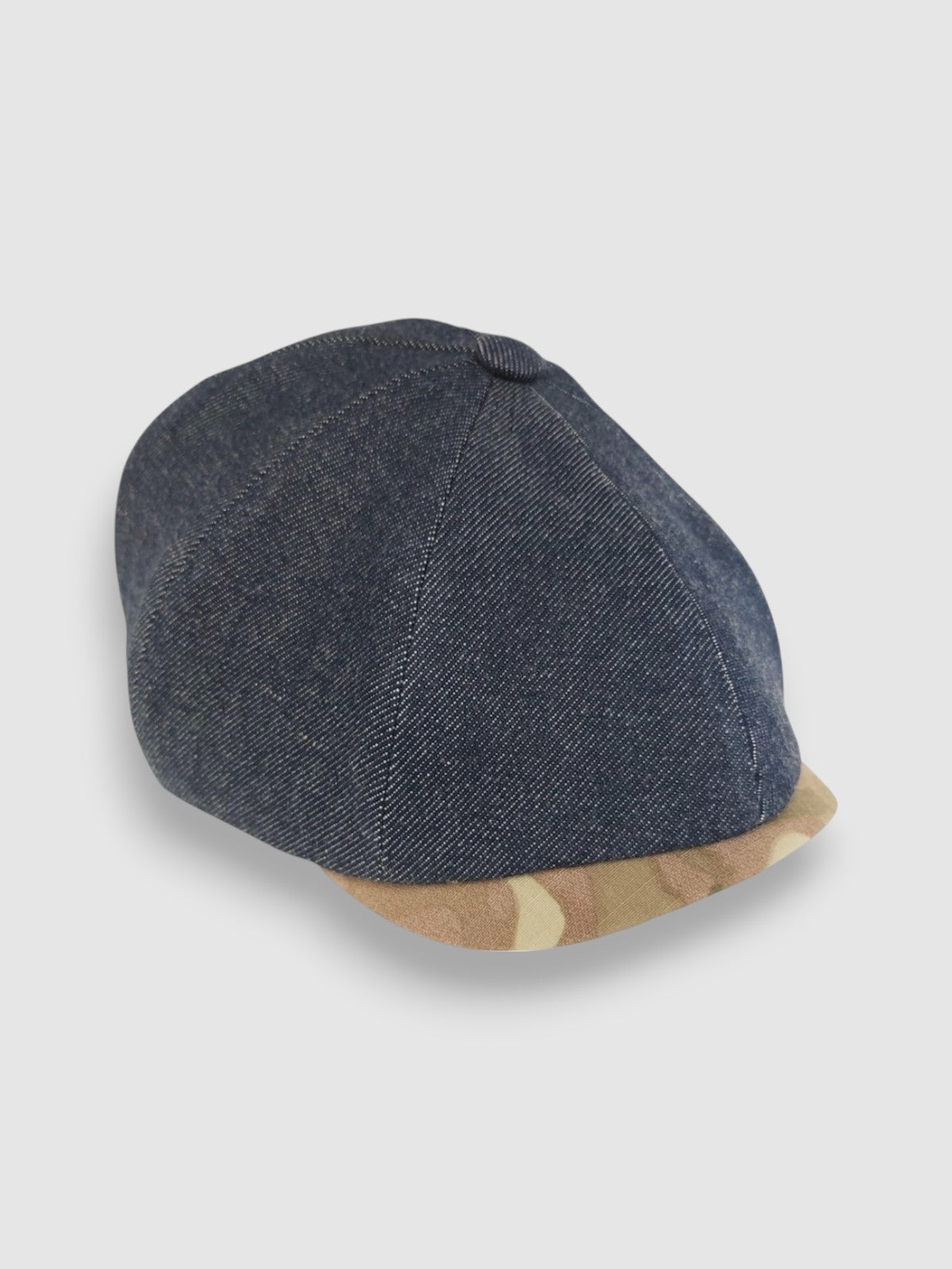 Newsboy cap in denim with camouflage peak – Jack’s Jeans slim-cut 8-panel flat cap handmade in Britain by Mister Miller. side view