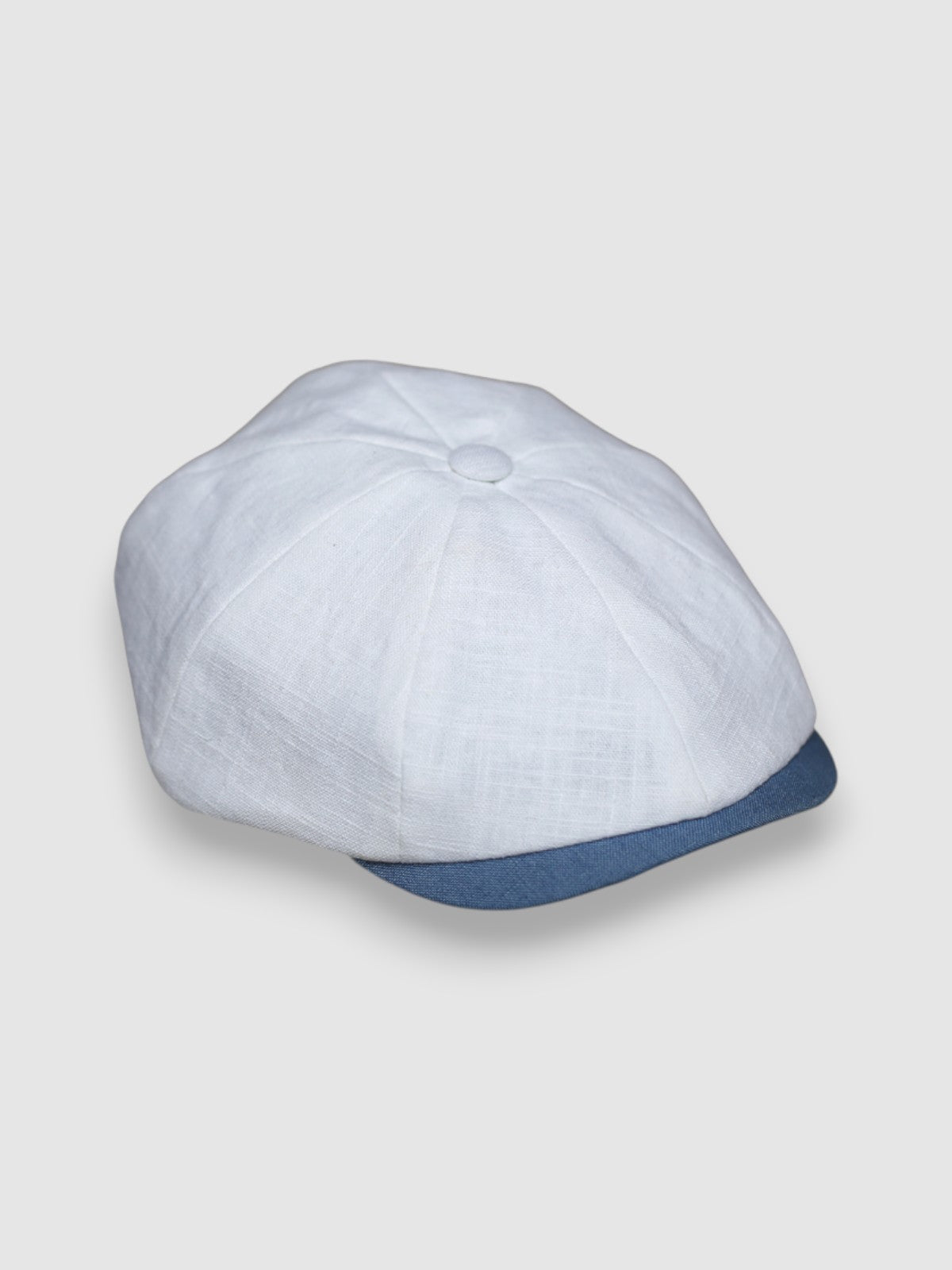 Slim-cut Newsboy cap in pale blue, red and white linen – Jack’s Sails handmade by Mister Miller. side view