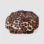 Leopard print velvet Bakerboy cap — oversized silhouette from the Leigh Francis x Mister Miller collection, featuring curved peak, bold 90s style, and signature 70s swirl lining.