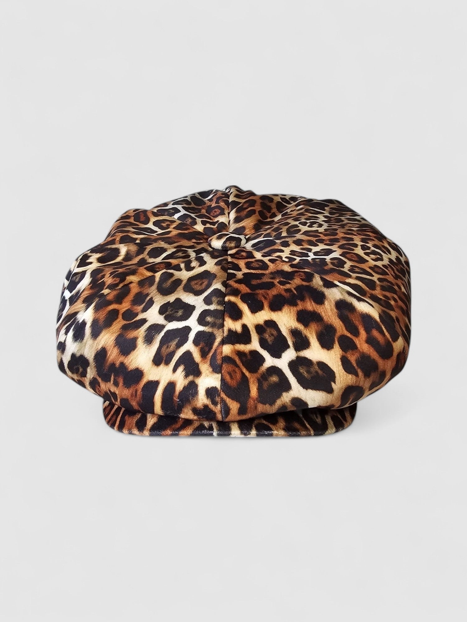 Leopard print velvet Bakerboy cap — oversized silhouette from the Leigh Francis x Mister Miller collection, featuring curved peak, bold 90s style, and signature 70s swirl lining.