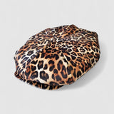 Leopard print velvet Bakerboy cap — oversized silhouette from the Leigh Francis x Mister Miller collection, featuring curved peak, bold 90s style, and signature 70s swirl lining. Side view