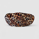 Leopard print velvet Bakerboy cap — oversized silhouette from the Leigh Francis x Mister Miller collection, featuring curved peak, bold 90s style, and signature 70s swirl lining. Rear view.