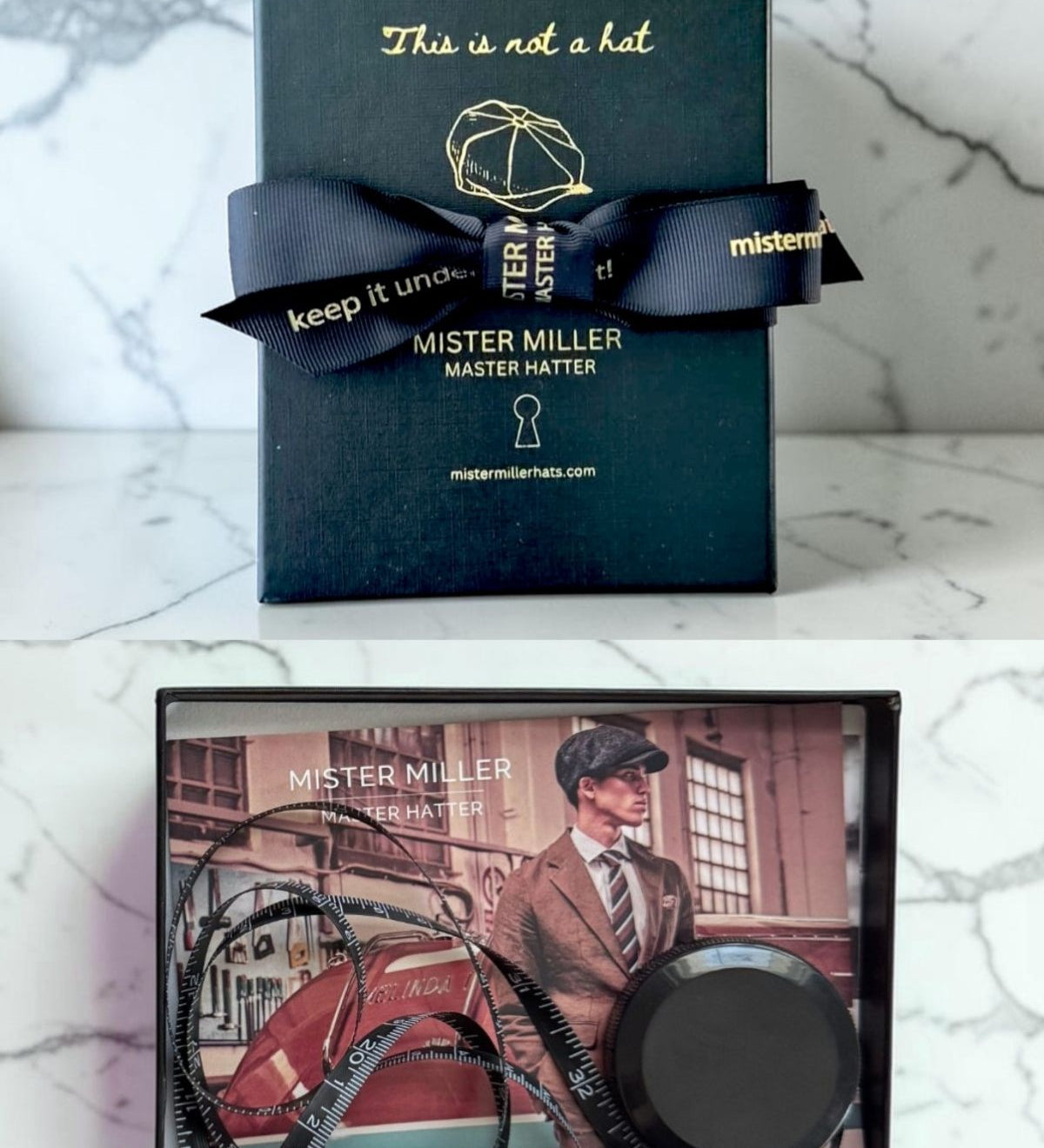 Mister Miller hat box with a bow and image of a tape measure on a card featuring a man wearing a hat