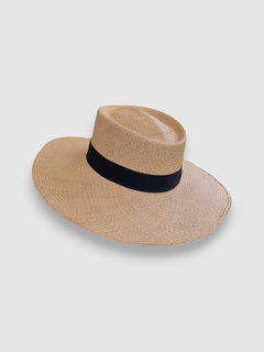 Wide brim Panama hat in natural Toquilla straw with black grosgrain ribbon, handmade in Ecuador, finished by Mister Miller.