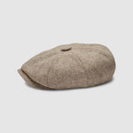 Bakerboy cap in beige herringbone Merino lambswool — Riley’s Peregrine by Mister Miller, handmade in Britain. profile view