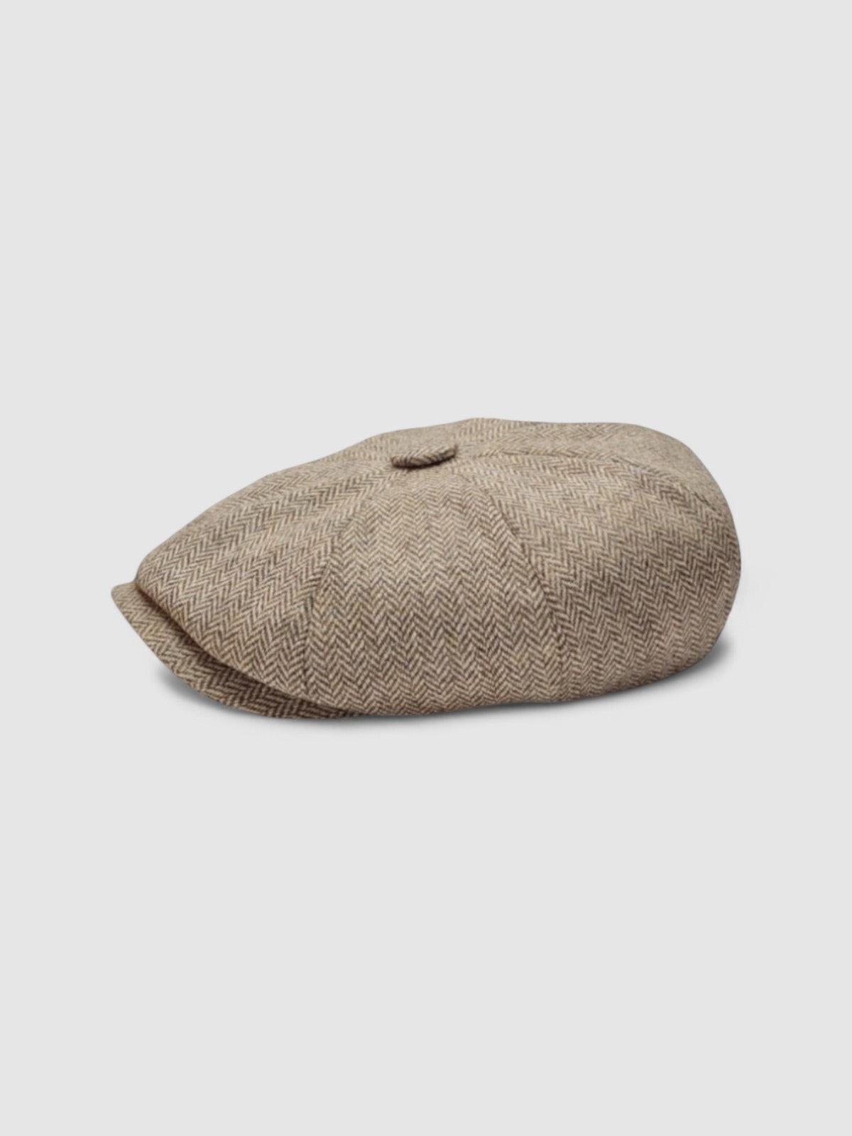 Bakerboy cap in beige herringbone Merino lambswool — Riley’s Peregrine by Mister Miller, handmade in Britain. profile view