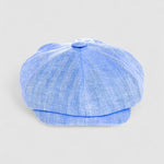 Bakerboy cap in light blue Irish linen herringbone — Riley Skies by Mister Miller, a breathable summer hat handmade in Britain. front view