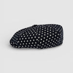 Navy Bakerboy cap with white polka dots profile view