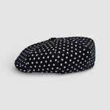 Navy Bakerboy cap with white polka dots profile view