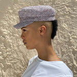 a woman wearing a Mister Miller linen mariner cap with pointillist weave – red, white, and blue sailor hat