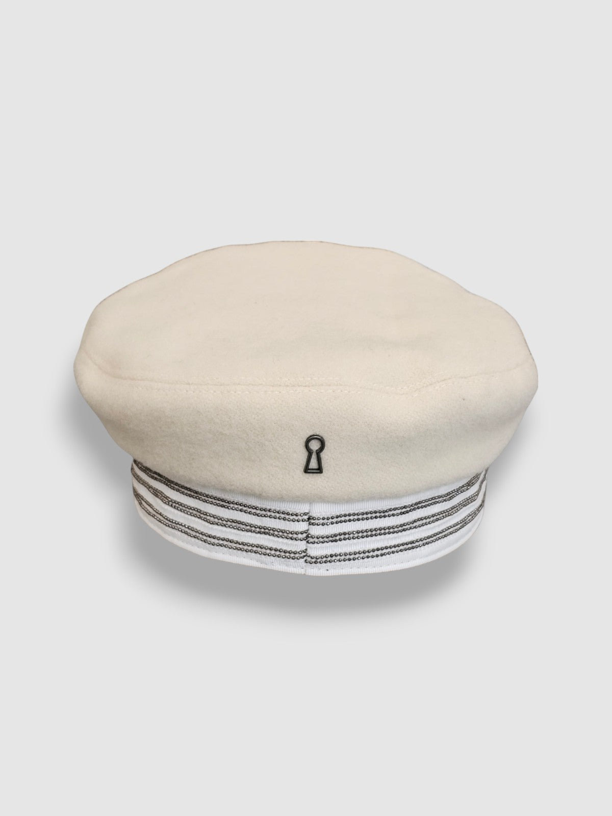 Cream wool sailor cap with silver chain detail – handmade by Mister Miller. rear view